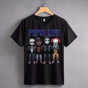 Black T-shirt with horror characters and "PEPSI LIFE" text displayed on a hanger.