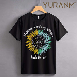 Black t-shirt with sunflower design, peace symbol, and text "Whisper words of wisdom, let it be."