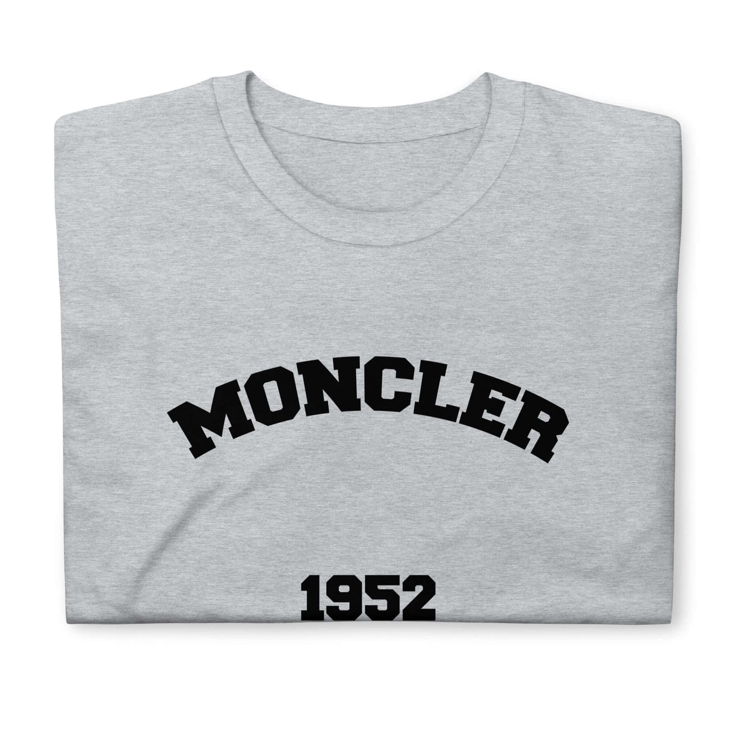 Grey designer t-shirt with "Moncler 1952" text, folded neatly.