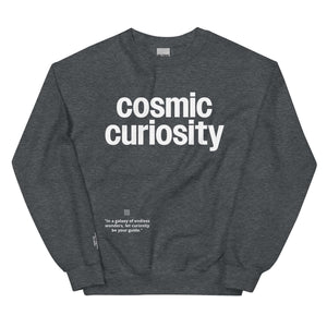 Cosmic Curiosity Unisex Sweatshirt in dark grey featuring a motivational quote for explorers and dreamers