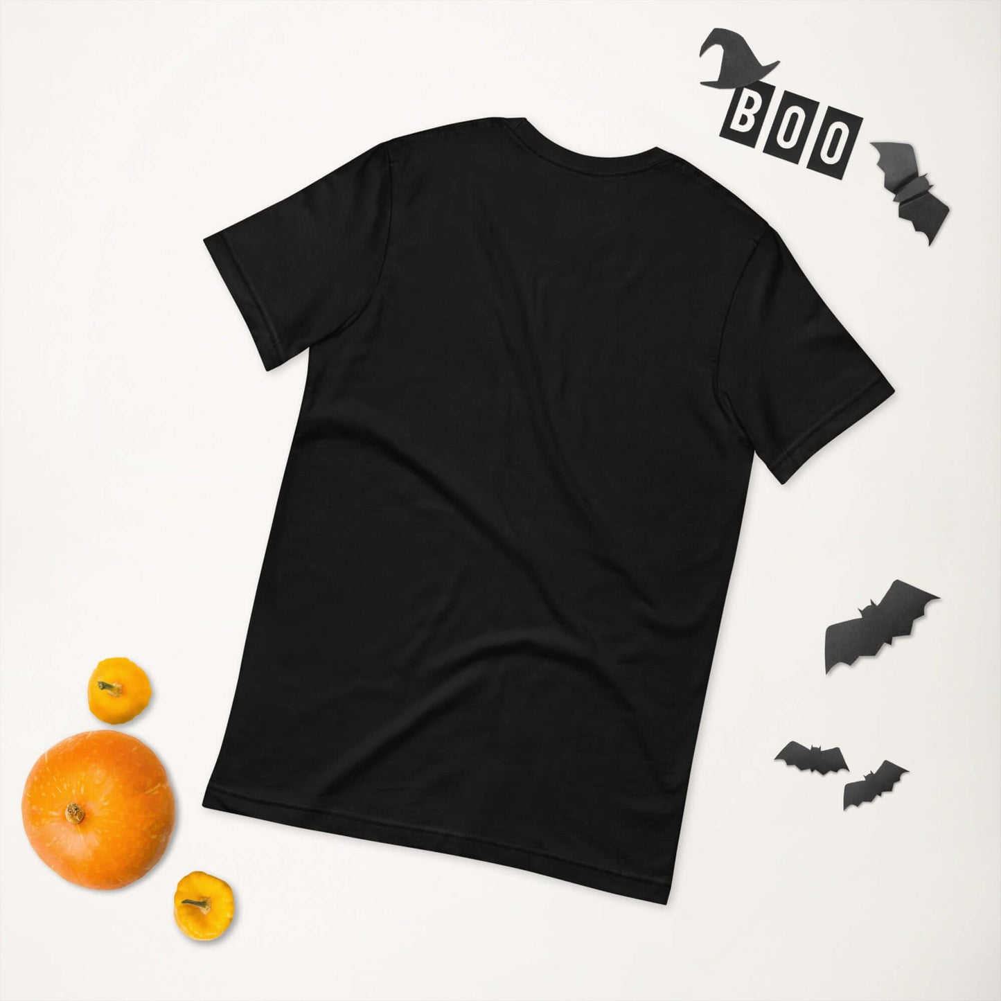 Black unisex t-shirt with Halloween decorations of bats, "Boo" letters, and pumpkins on a white background.