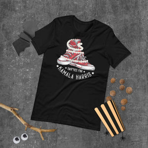 Unisex black t-shirt featuring Swifties for Kamala Chucks and Pearls Harris VOTE design on a textured background.