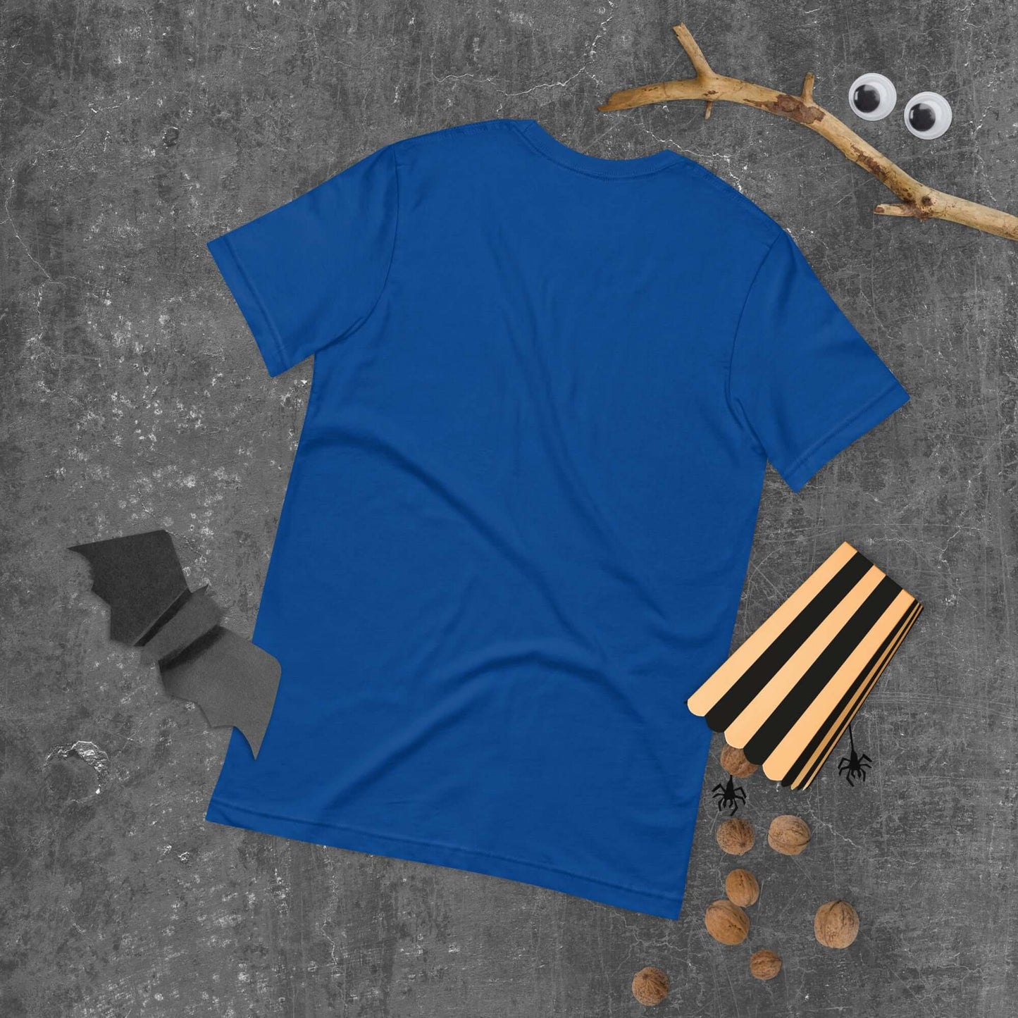 Blue unisex t-shirt with Halloween-themed decorations including bat, spider, and walnuts on a gray textured background